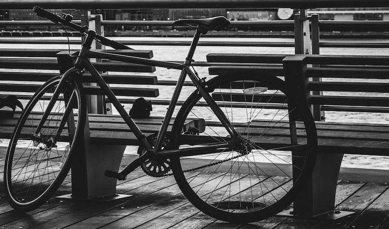 Black Road Bike Beside Bench